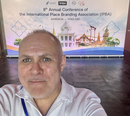 Steve Millington pictured in front of a IPBA banner